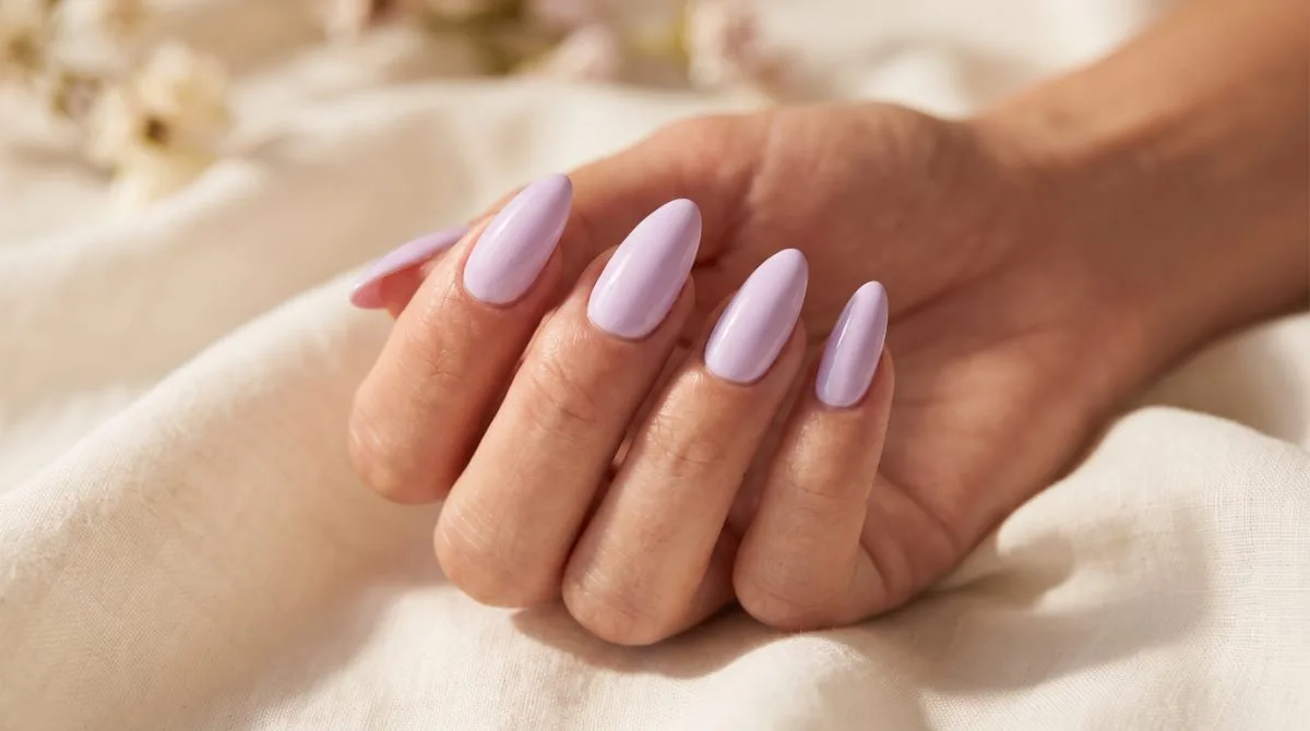 Long almond Gel X extensions in soft lilac gel polish